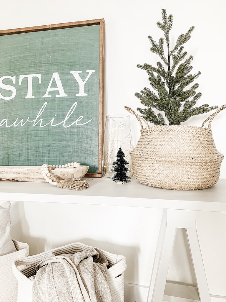 Tree in basket on console table