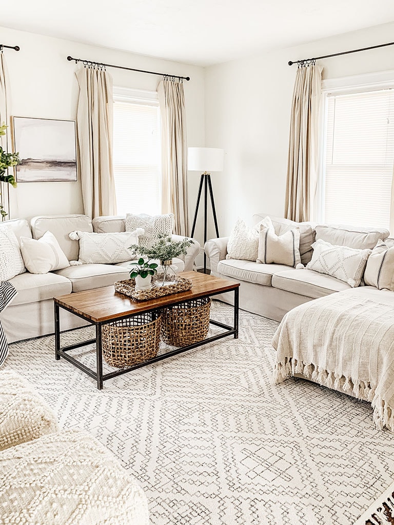 Sherwin Williams Alabaster painted walls. Rectangle coffee table with geometric area rug.