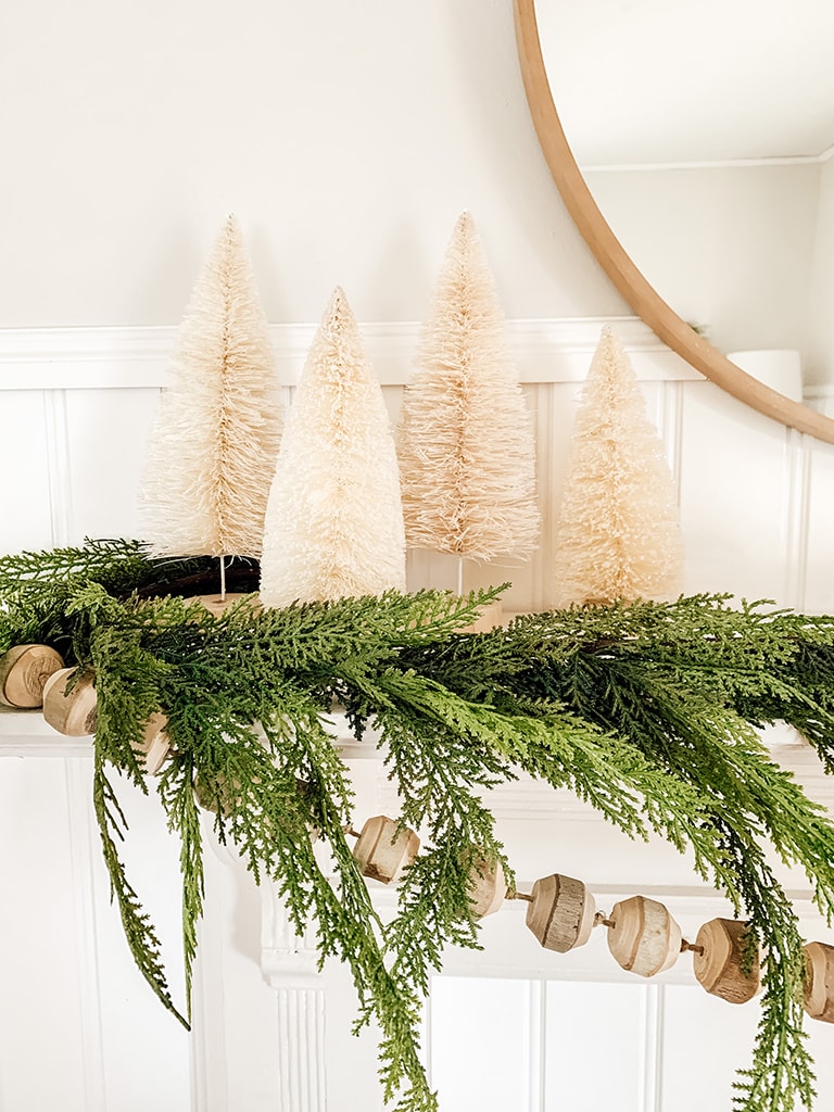 Christmas Mantel with bottle brush trees and garland