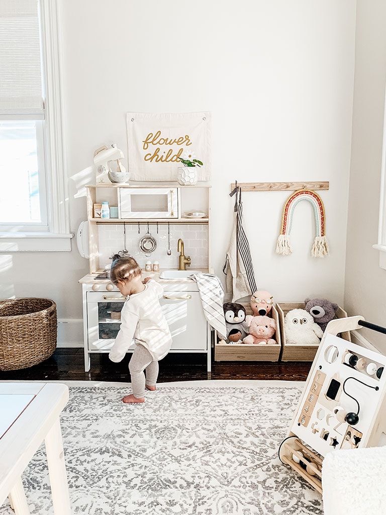 girl at play kitchen