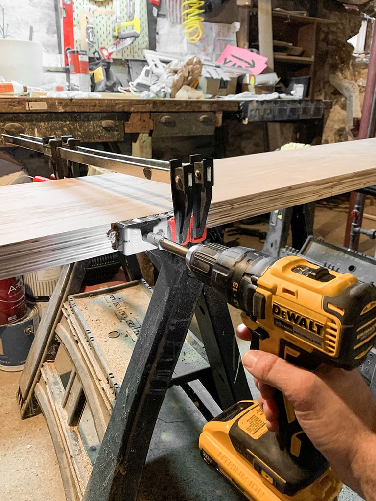 Predrilling holes for floating shelf brackets