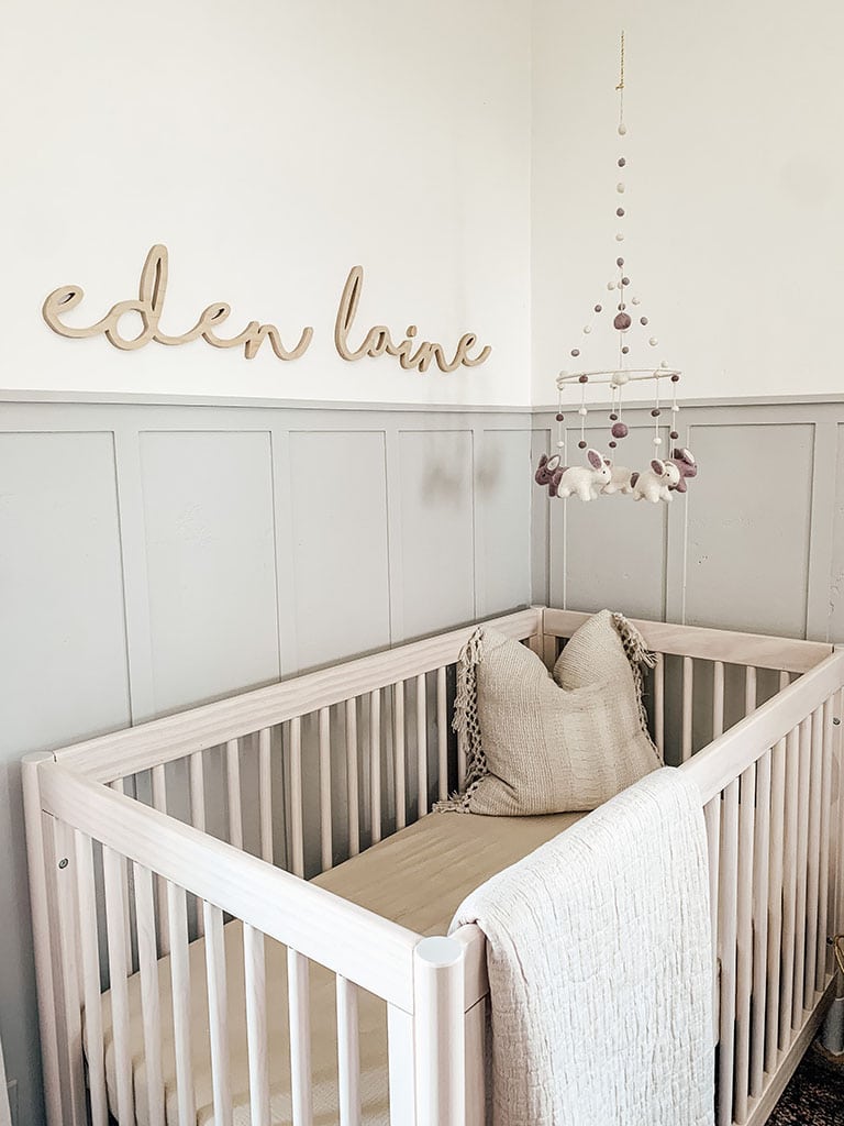 Custom nursery name sign above crib