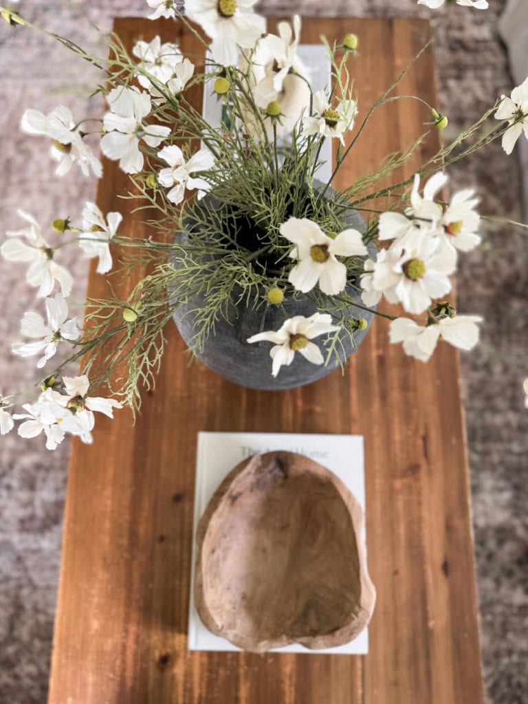 Coffee table with Cosmos and wood bowl